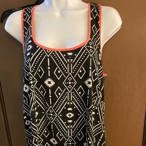 Zip back racer back tank top. Excellent condition, almost sheer material.